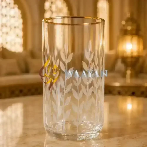 Clear glass vase with an etched leaf design and a gold rim, perfect for elegant floral arrangements.