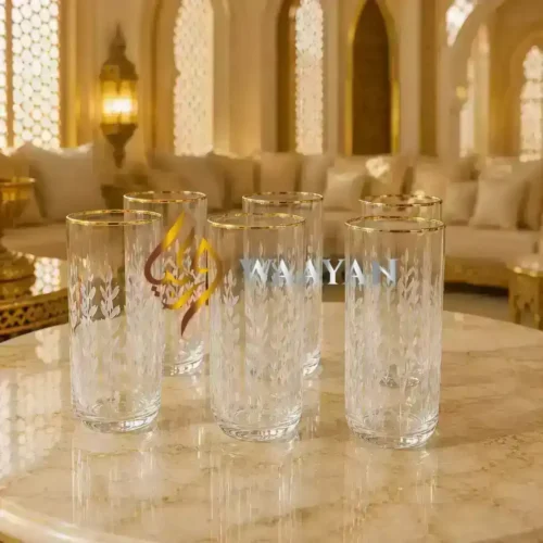Elegant glass tumblers with intricate leaf patterns, featuring gold trim for a sophisticated touch. Perfect for any occasion.