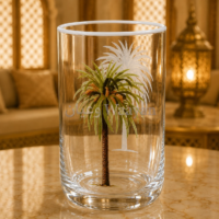 clear glass tumbler with painted green palm tree and white etched palm motif