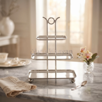 3-tier rectangular serving stand in polished silver stainless steel with ring top handle and ball feet