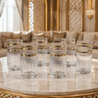 Set of 6 clear glass highball glasses with vertical ribbing and dual gold bands near the rim