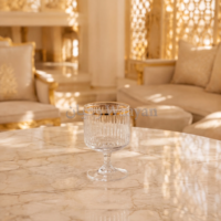 6pgs1.3 (5) Clear ribbed glass goblet with gold rim on a short stem