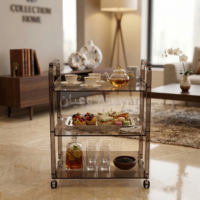 at1.1 (3) Smoked brown acrylic serving trolley with side handles, three shelves, and four caster wheels