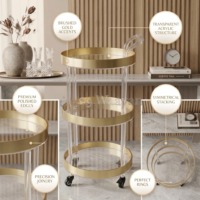1000157955290_3 Clear acrylic three-tier serving trolley with brushed gold rims, acrylic handle, and black caster wheels