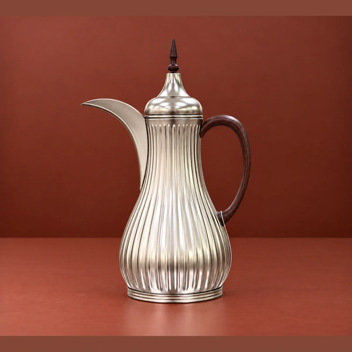 1L vacuum flask with fluted silver-tone body, curved spout and dark handle styled on a serving tray