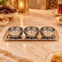 4-piece silver stainless steel condiment set with three bowls on rectangular tray, polished with beaded rims and edge