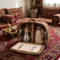 Gemini_Generated_Image_gnehhfgnehhfgneh tan fabric zippered carry bag with silver dallah coffee pot with gold domed lid and cream thermal carafe, top handle