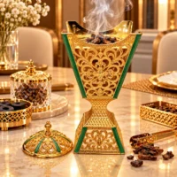 Luxurious Golden Mabkhara with Rising Smoke Incense burner in gold-tone embossed metal with green enamel panels, with removable domed lid