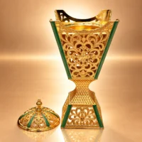 Ornate Emerald Gold Incense Censer Gold-tone metal incense burner with green enamel accents and a removable domed lid