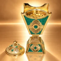 Ornate Golden Green-Enamel Incense Burner Gold-tone metal incense burner with green enamel panels and a matching domed lid with finial, lid shown removed