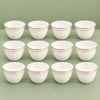 Cawa Cups, 12-Piece Set with Gold-Tone Rim Cawa cups in a 12-piece set, showing white cups with gold-tone rims