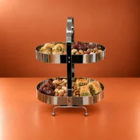 Stainless Steel Sweet Stand with Two Serving Tiers Stainless steel sweet stand with two tiers displaying dates, nuts, and pastries