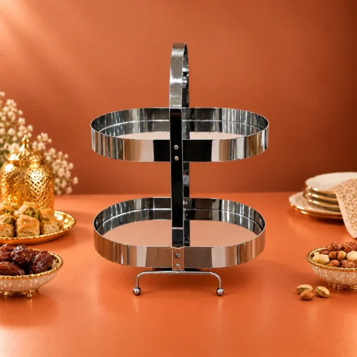 Stainless Steel Sweet Stand with Two Serving Tiers Two-tier stainless steel sweet stand arranged on a table with serving dishes