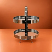 Stainless Steel Sweet Stand with Two Serving Tiers Stainless steel sweet stand with two tiers displaying dates, nuts, and pastries