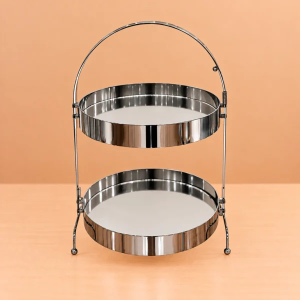 Two Tier Serving Stand, 25 × 42 Cm Two tier serving stand with two round reflective trays and an arched handle