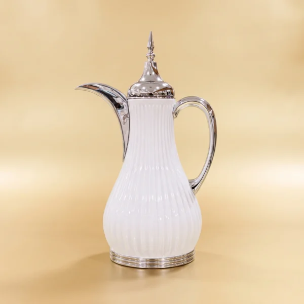 White Curved Vacuum Flask – 1L Serving Flask White Curved Vacuum Flask with ribbed white body, curved spout, handle, and reflective-looking details